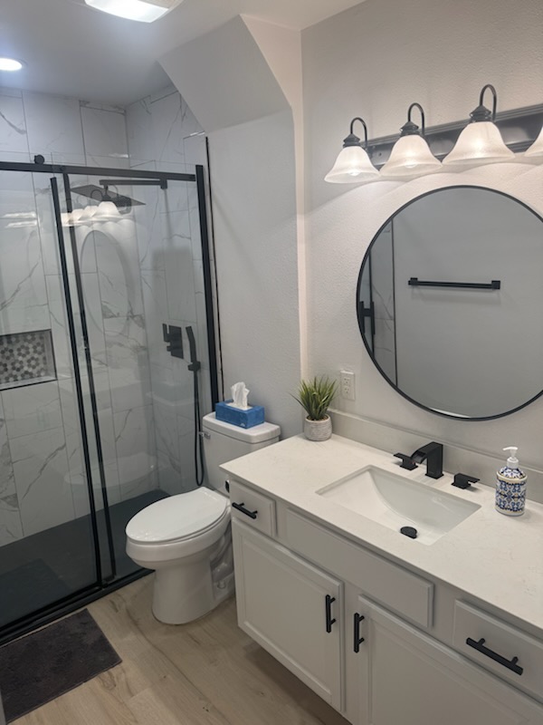 Finished bathroom with walk-in glass shower